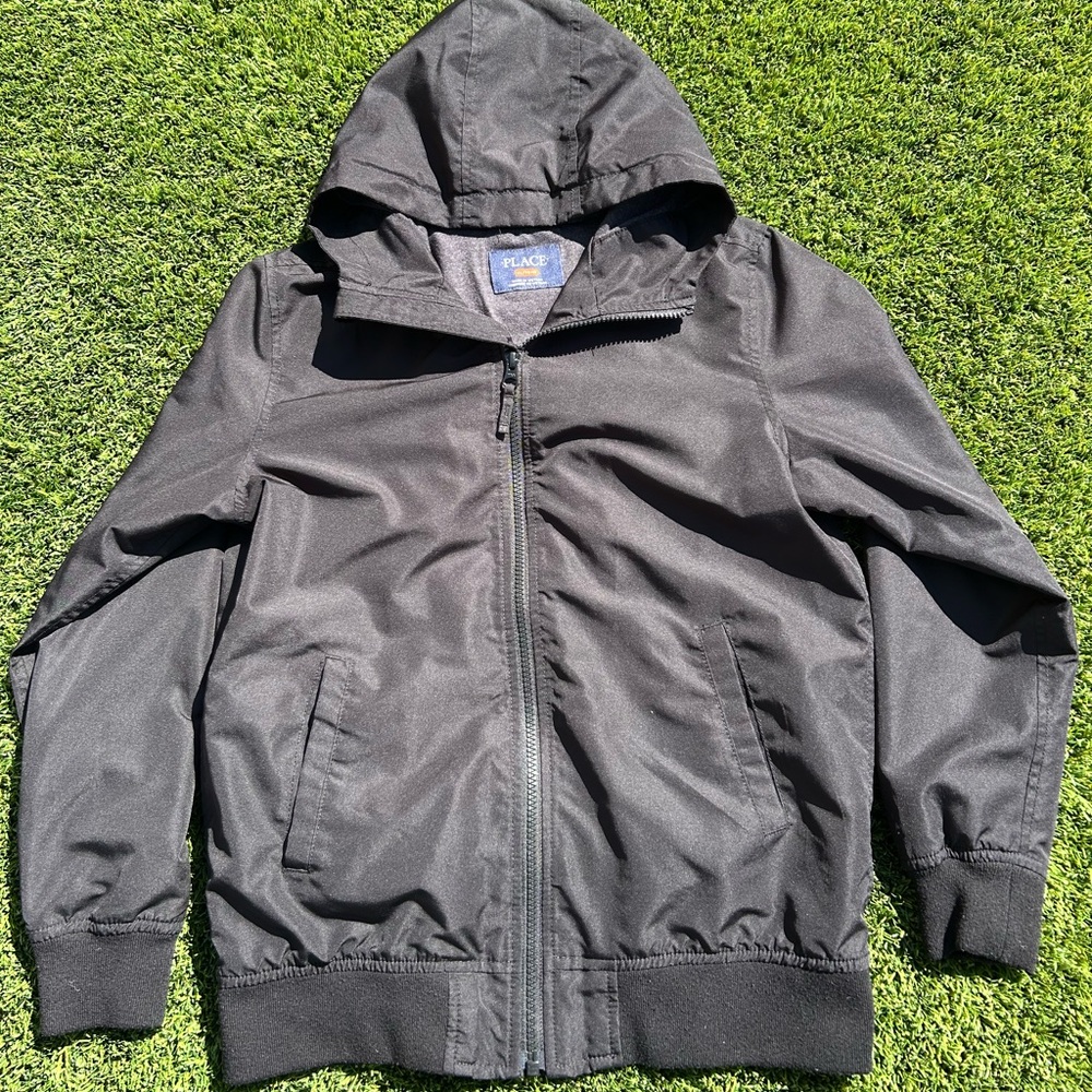 PLACE black windbreaker